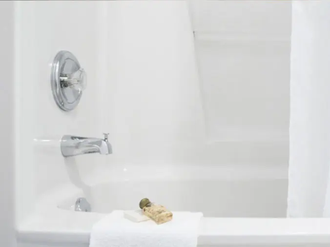 Bathtub with polished chrome faucet