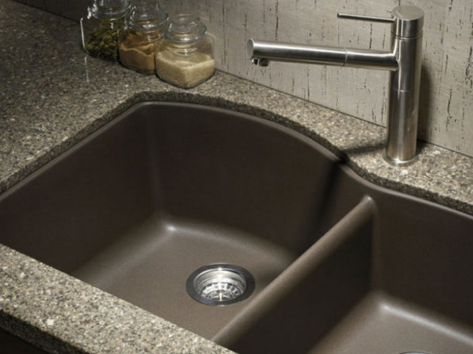 Dark colored kitchen sink with double basin