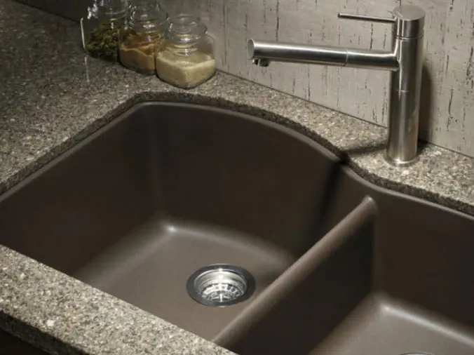 Dark colored kitchen sink with double basin